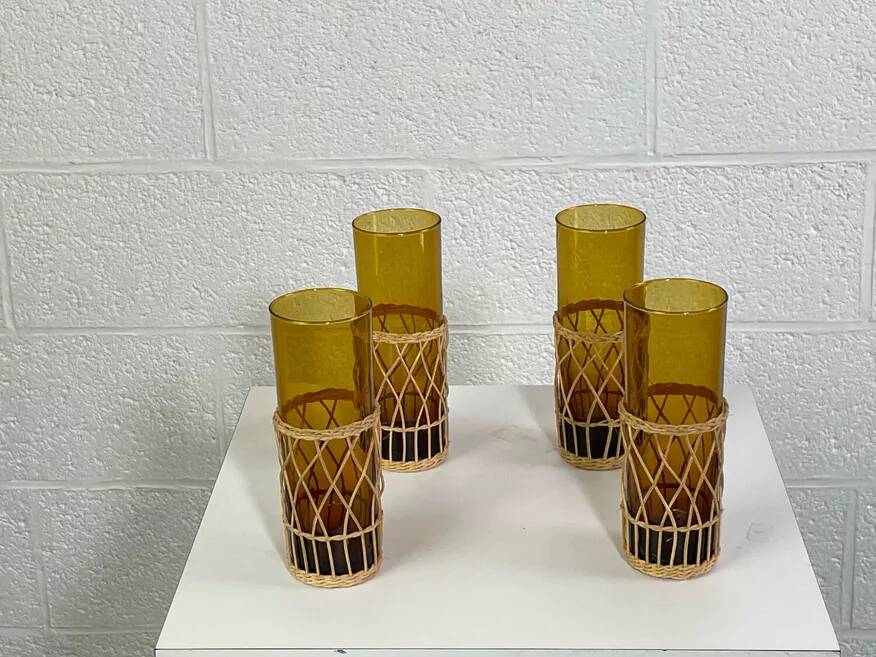 Vintage service for orangeade in amber glass and wicker.