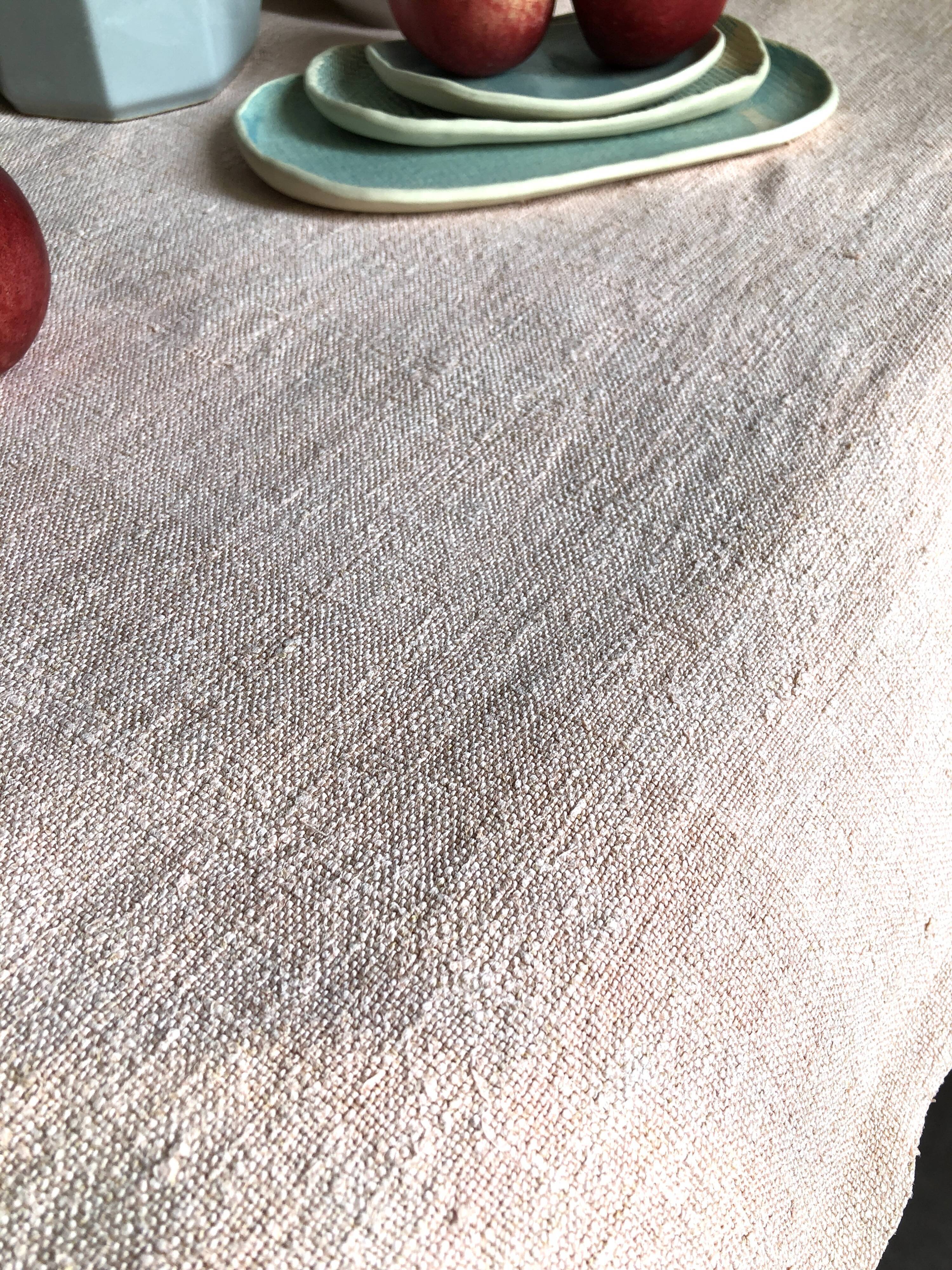 Old hemp harvest tablecloth tinted in pink tea