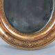 Antique oval mirror with original stucco and gilt wood frame, 37x31 cm. Beautiful patina.
