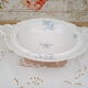 Compotier on porcelain pedestal decoration pale blue flowers