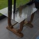 Art Deco coffee table in glass, wood, and brass.