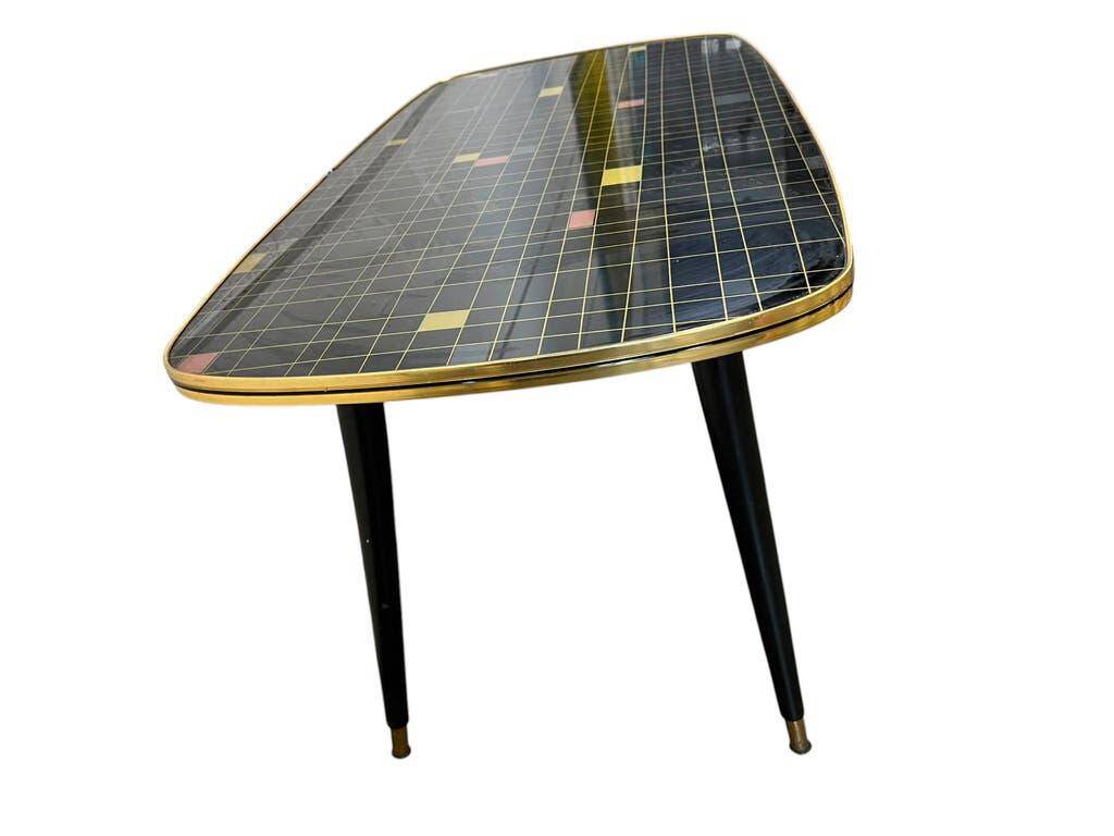 Table basse vintage en formica noir et or