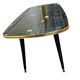 Table basse vintage en formica noir et or