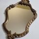 Antique rococo mirror in patinated gilded wood with shell decoration 49 x 31 cm