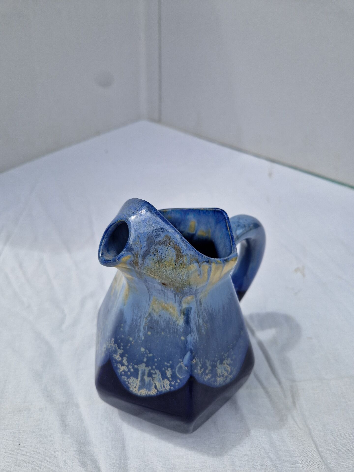 Old flamed ceramic jug. Very beautiful shades of blue, 6 sides.