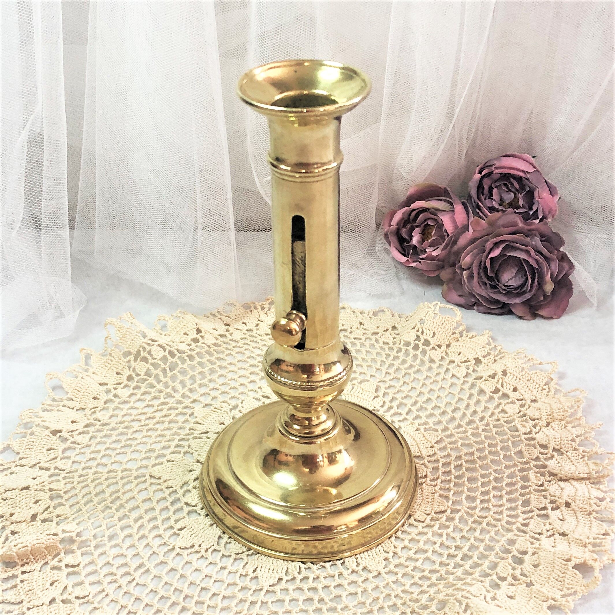 Gilded copper push candle holder