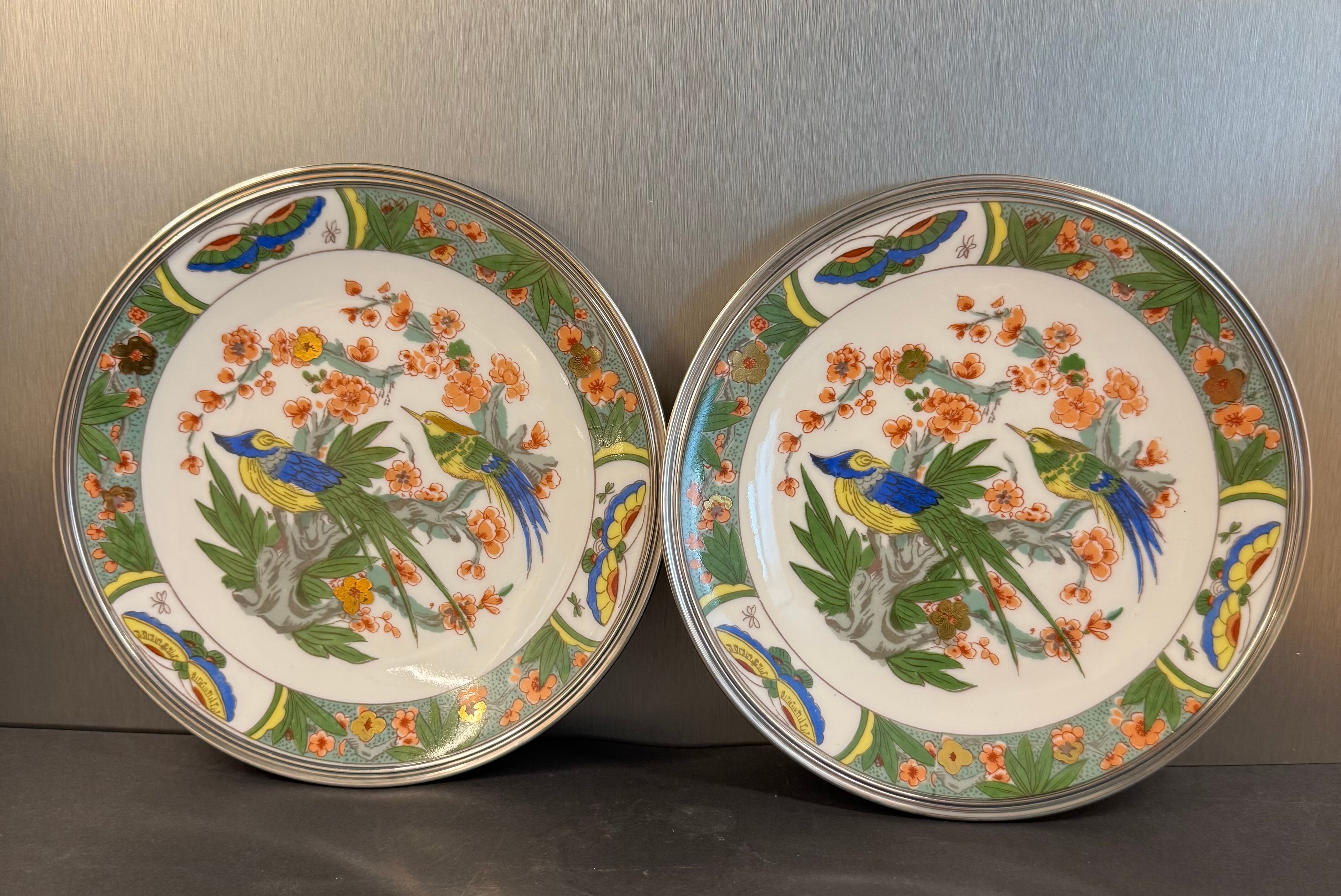 Two Raynaud Limoges plates and Tetard brothers silver.