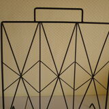 Magazines rack with very fine black metal geometric
