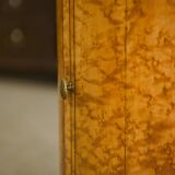 Empire gueridon in mottled maple with a blue stone top, 19th century.