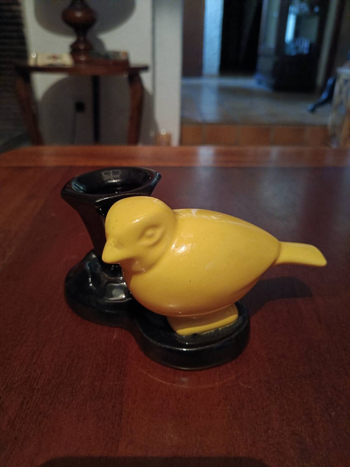 Yellow canary figurine and its candle holder