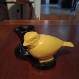 Yellow canary figurine and its candle holder