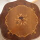 Gueridon in cherry wood with patterned veneer on the top.