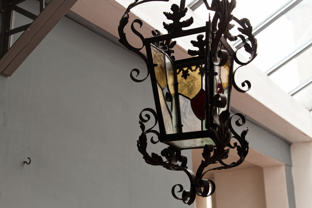 Wrought iron lantern and stained glass windows