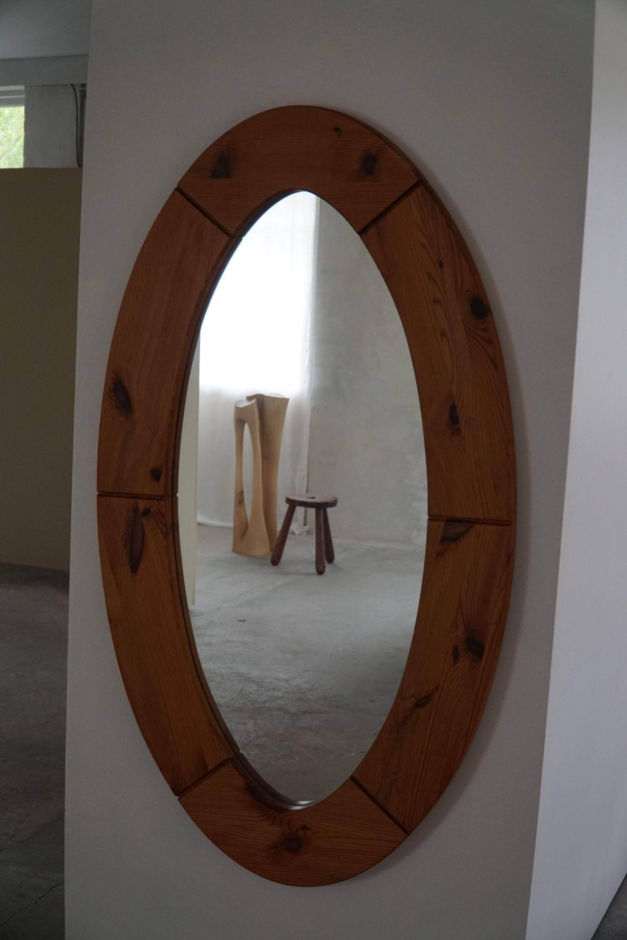 Large oval wall mirror in solid pine by Glasmäster Markaryd, Sweden, 1960s.