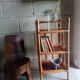 Shelf selette on wooden feet and vintage rattan