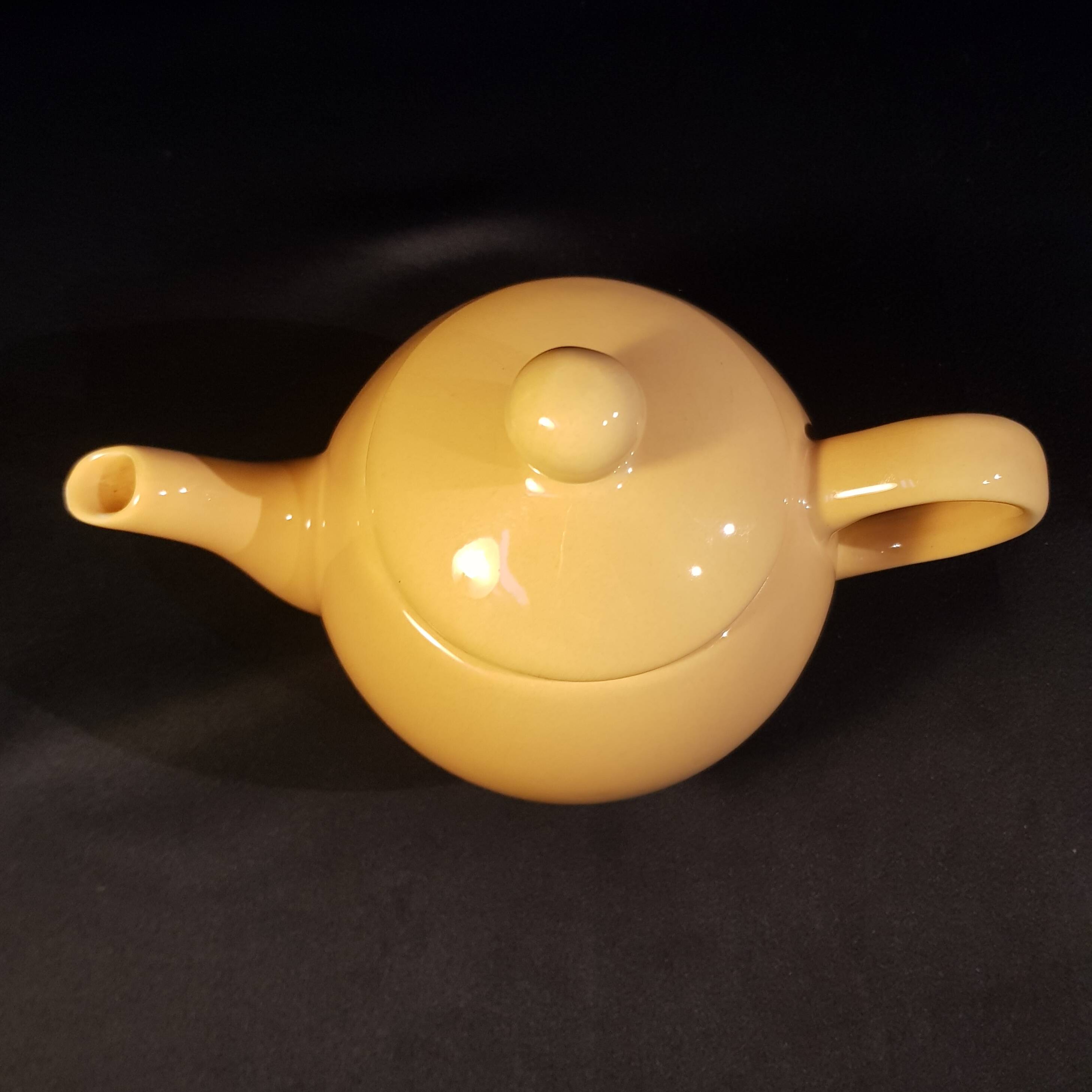 Yellow ceramic teapot