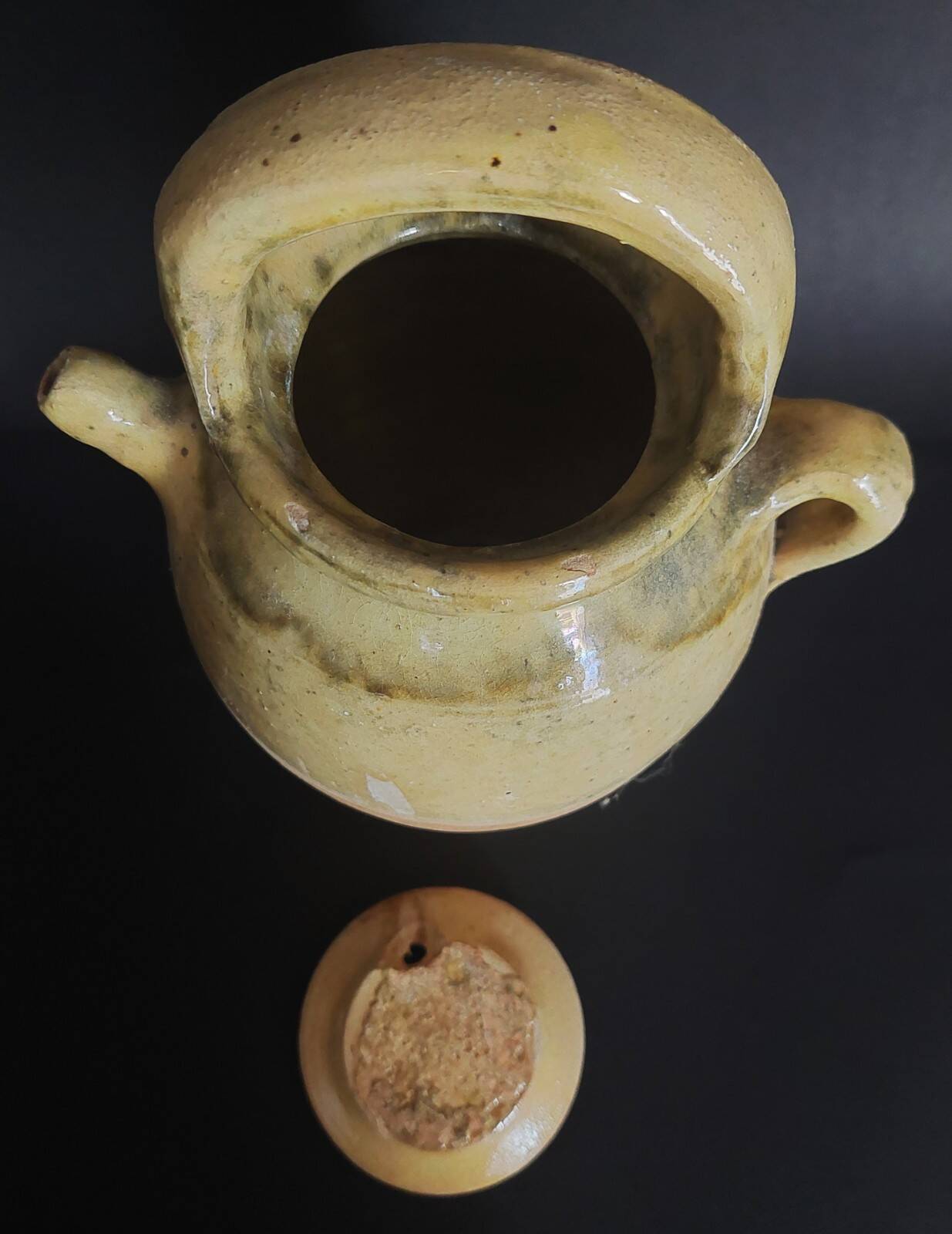 Yellow glazed terracotta gargoulette carafe with lid, early 20th century.
