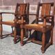 Pair of oak armchairs with straw seats and backs.