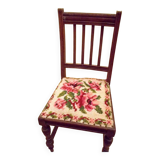 Wooden chair with embroidered seat