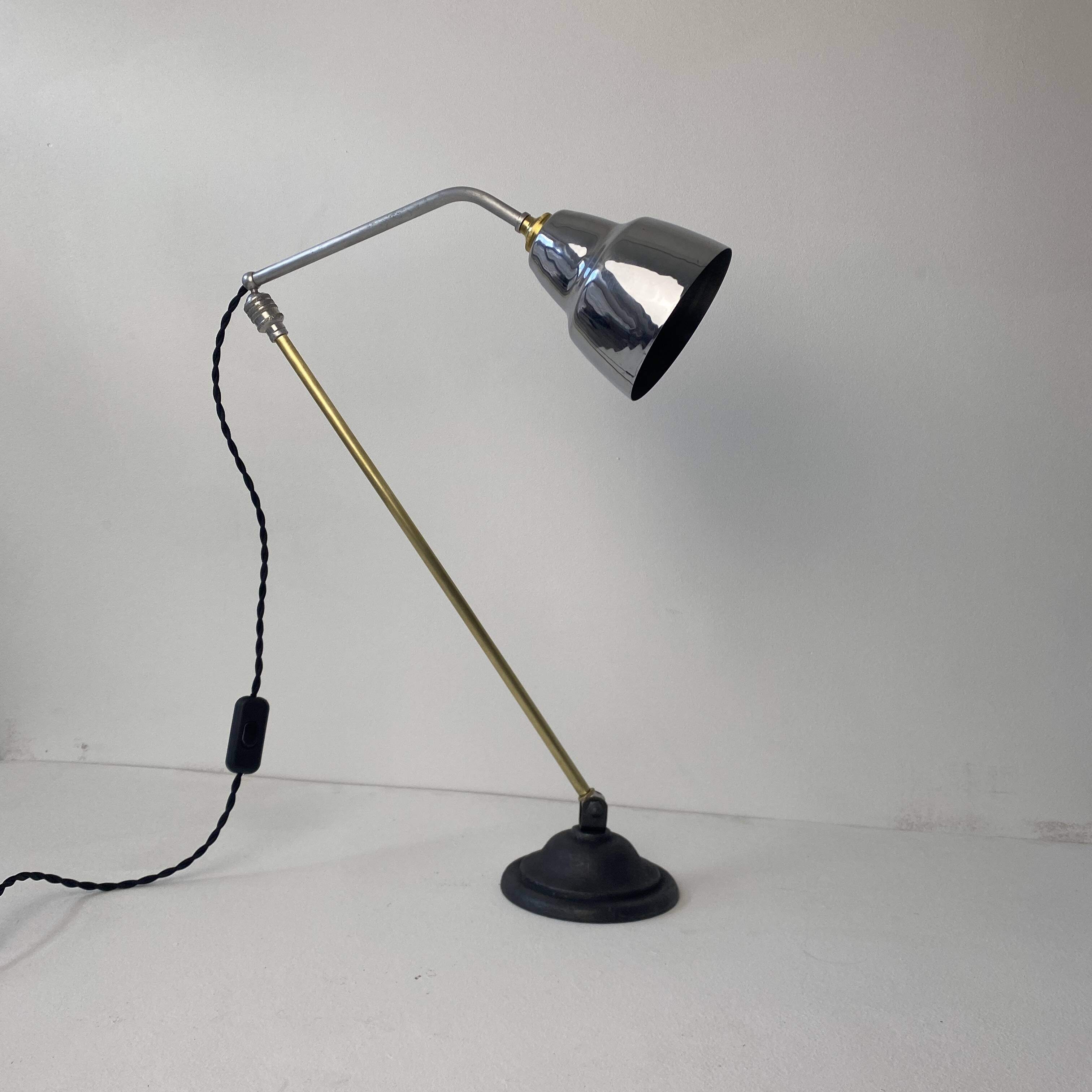 Old articulated industrial workshop lamp