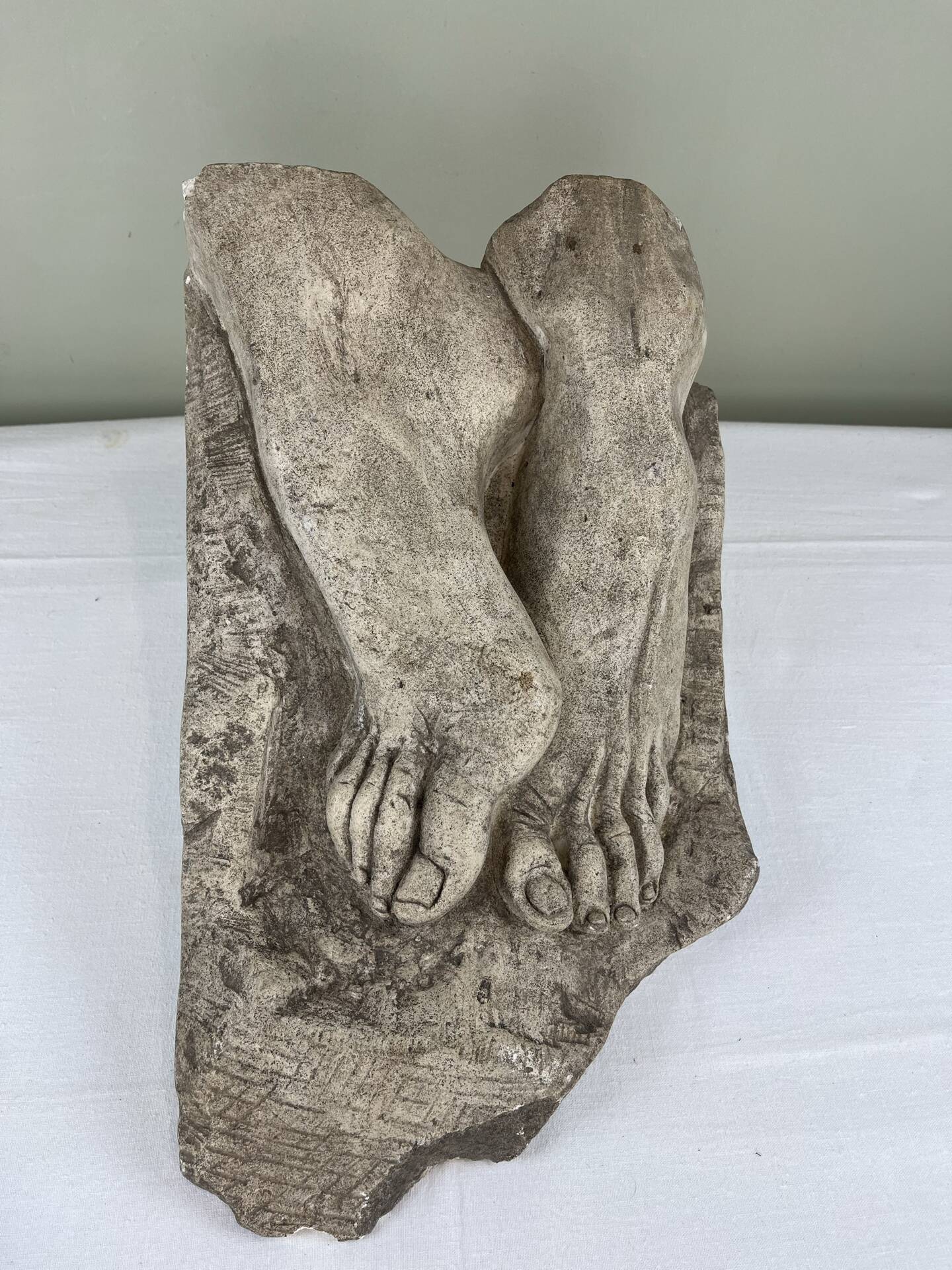 Stone sculpture, two feet on a block, signed D. Paillot.