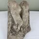 Stone sculpture, two feet on a block, signed D. Paillot.