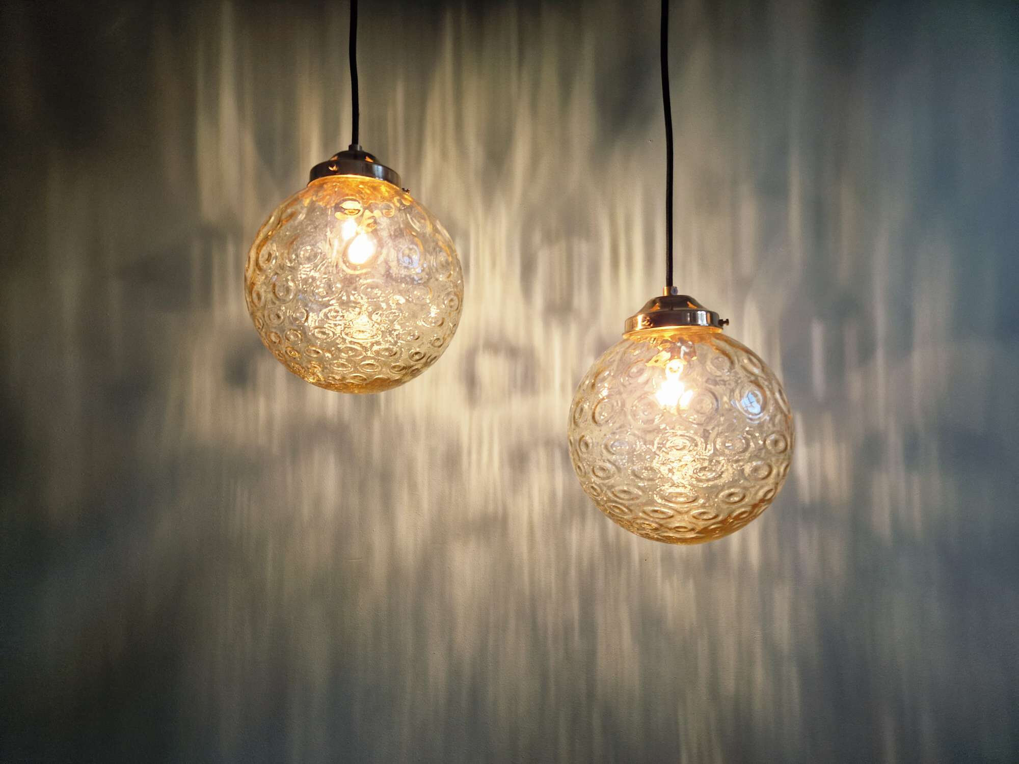 Pair of amber bubble glass pendant lights, 1970s