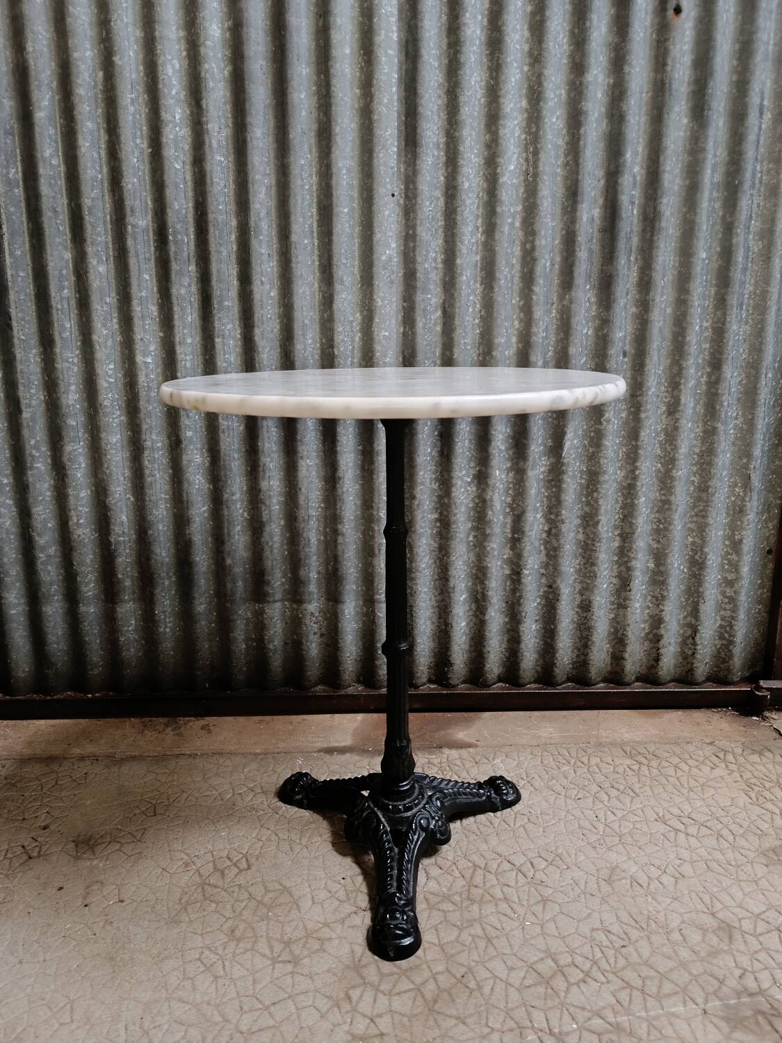Round marble bistro table with cast iron legs