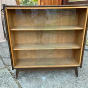 Mid-century brown wooden library (beech & pine) with glass doors from the 1960s.