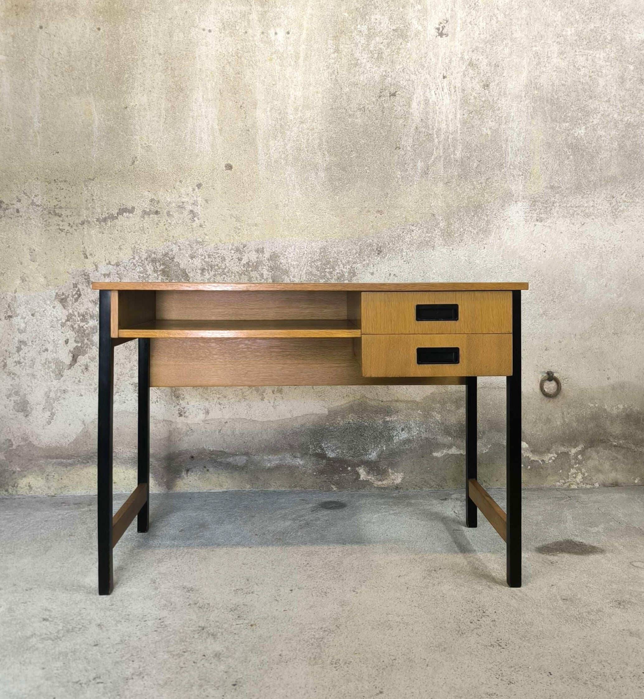 Vintage desk in modernist style made of wood.
