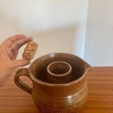 Large antique brown glazed stoneware jug with cork stopper.