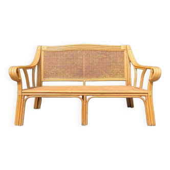 Vintage rattan and cane sofa, old garden furniture, veranda terrace furniture