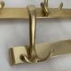 Three vintage 1960s gold coat racks with 4, 3 and 2 hooks