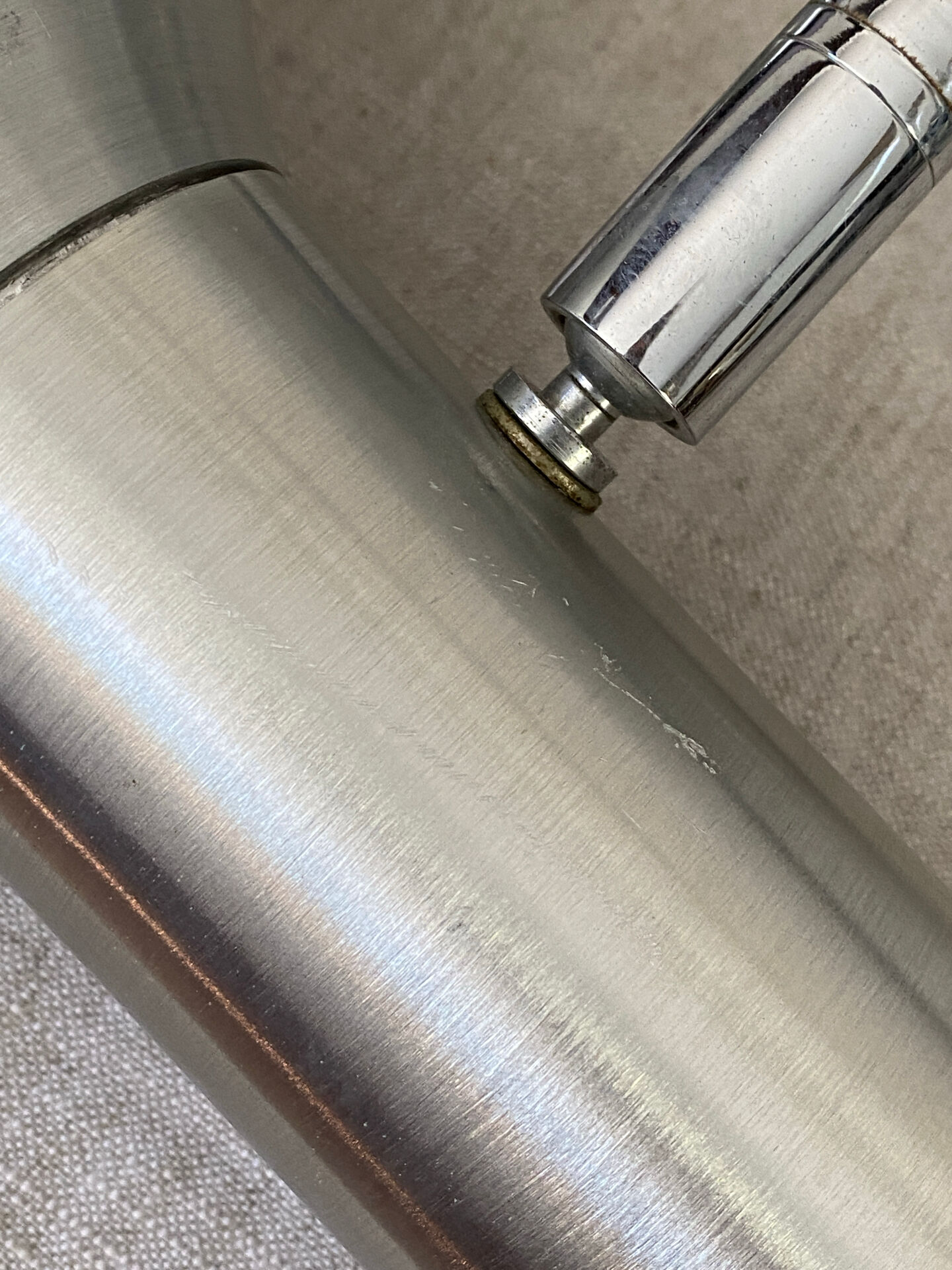 Pair of brushed metal wall sconces