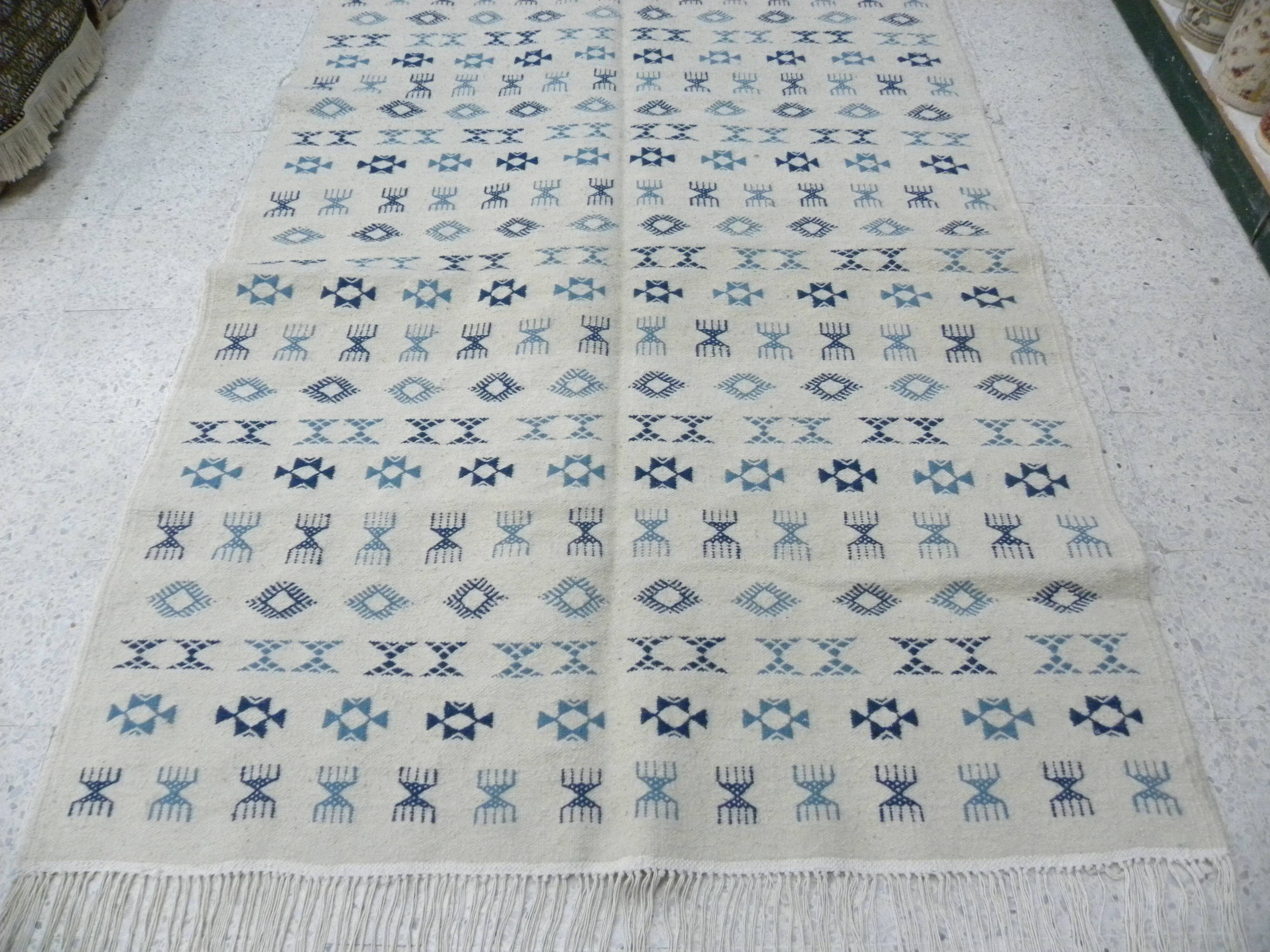 Nomadic Tunisian Berber rug, margoum kilim, ethnic in beige and blue wool.