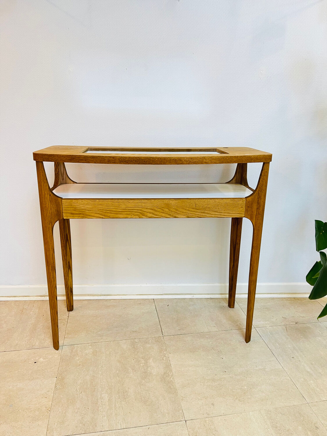 Small contemporary console in stained walnut wood.