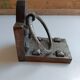 Medieval-style bookends, antique door handle.
