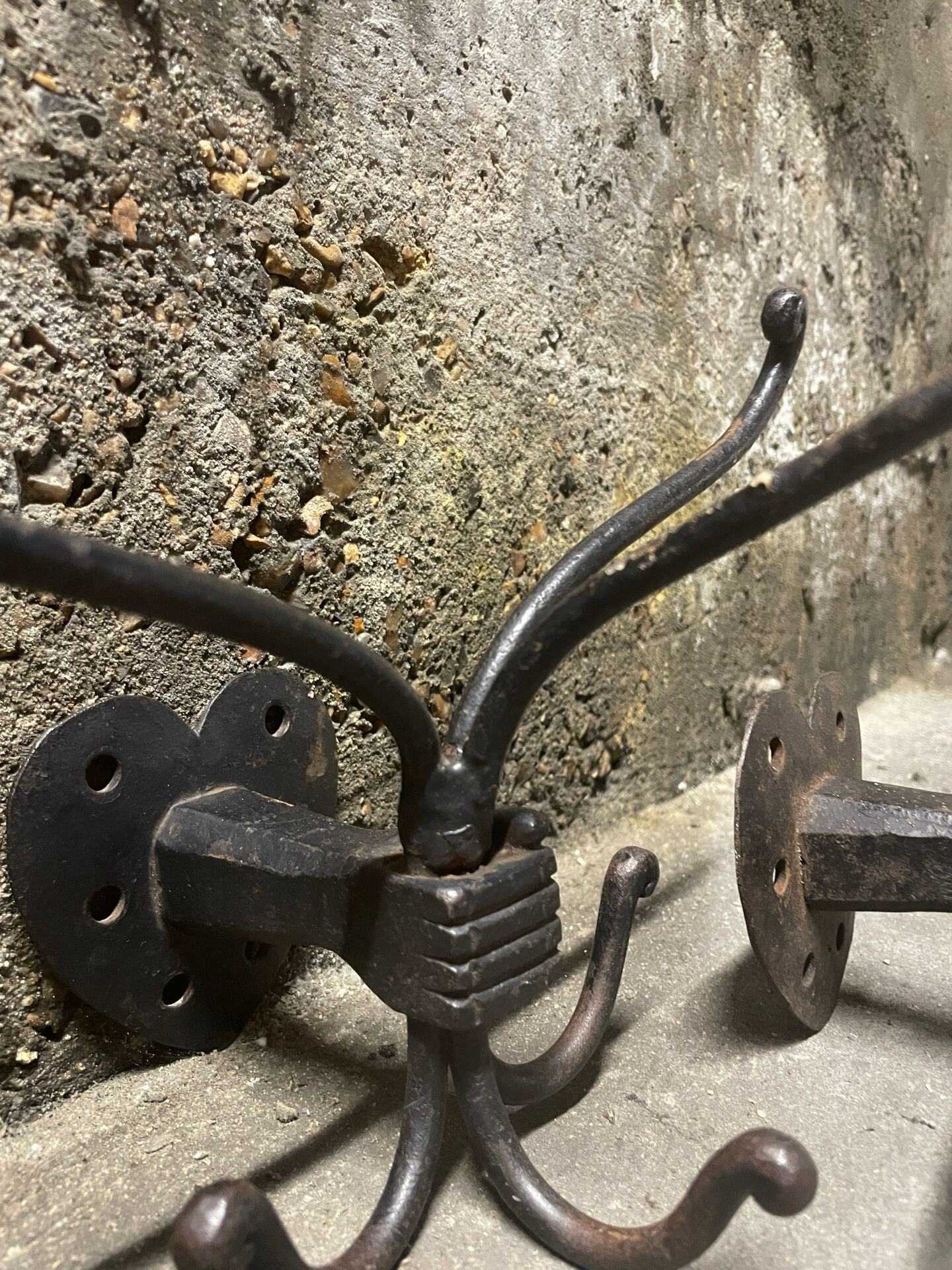 Brutalist pair of wall-mounted coat hooks.