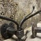 Brutalist pair of wall-mounted coat hooks.