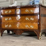 Louis XV style commode in rosewood and palisander veneer, gilt bronze mounts, and Rance marble top.