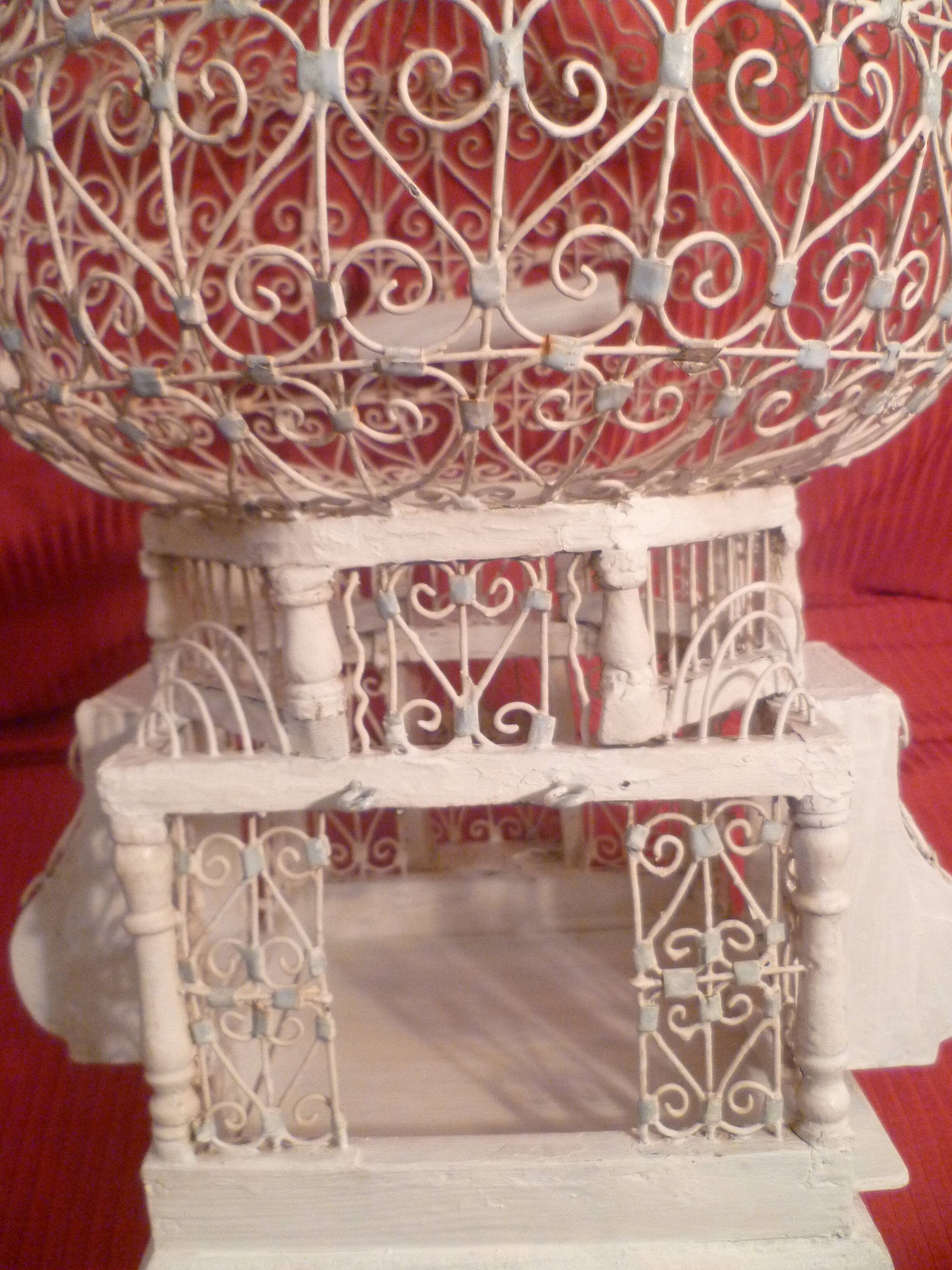 Antique handmade birdcage in metal and wood