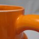 Pichet orange St Clément années 60