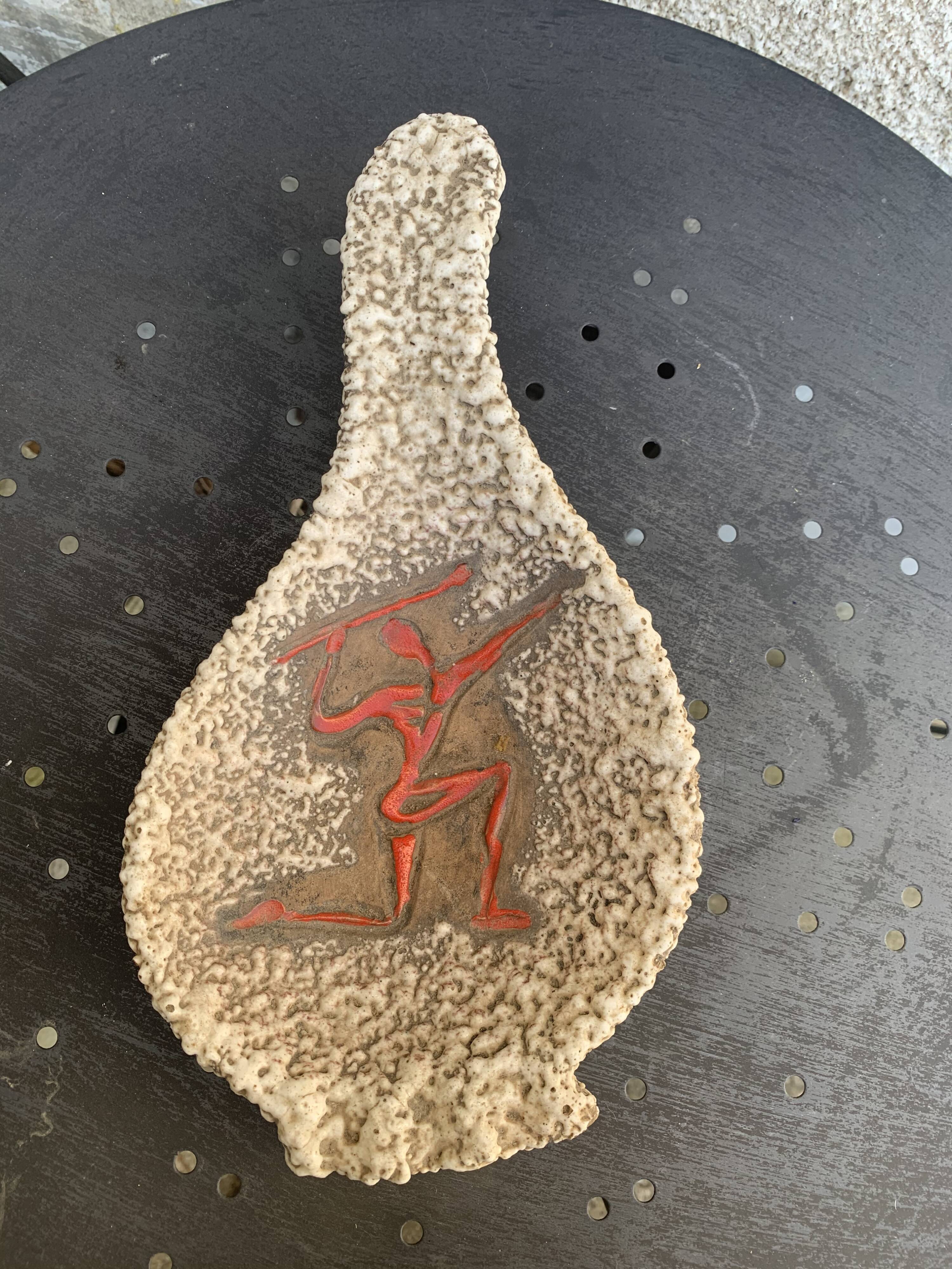 Glassed ceramic cut enamelled prehistoric warrior motif vintage red 1950