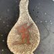 Glassed ceramic cut enamelled prehistoric warrior motif vintage red 1950