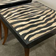 Striking pair of Italian zebra inlaid tessellated stone tables with refined curves