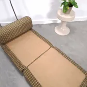 Vintage pull-out sofa bed, brown checked lounge chair with chrome.