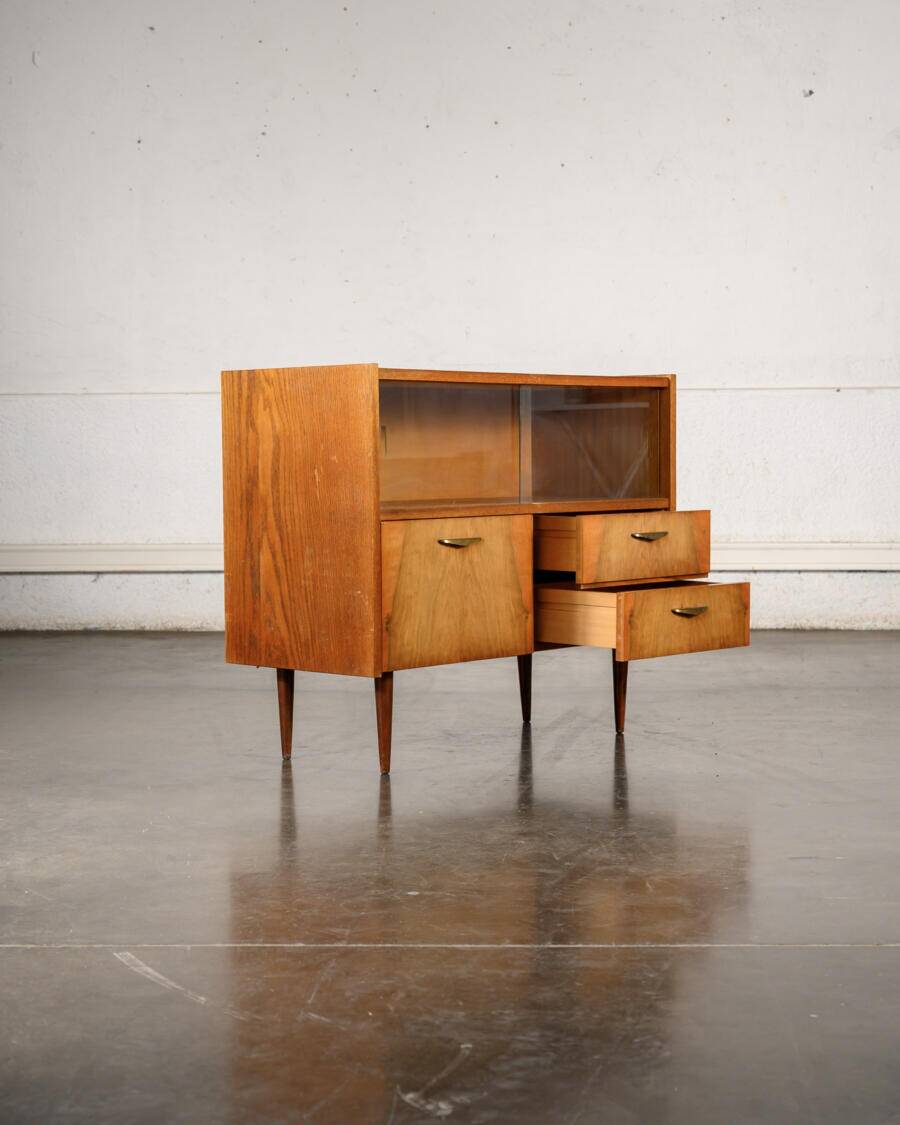 Old TV cabinet with brass handles.