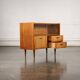 Old TV cabinet with brass handles.