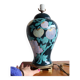 Vintage ceramic lamp with floral decoration.