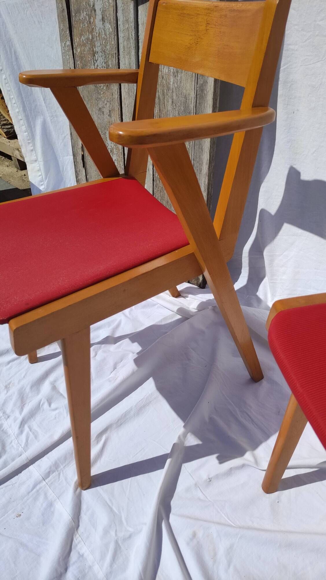 Pair of wooden armchairs and skaï foot compass of the 50s